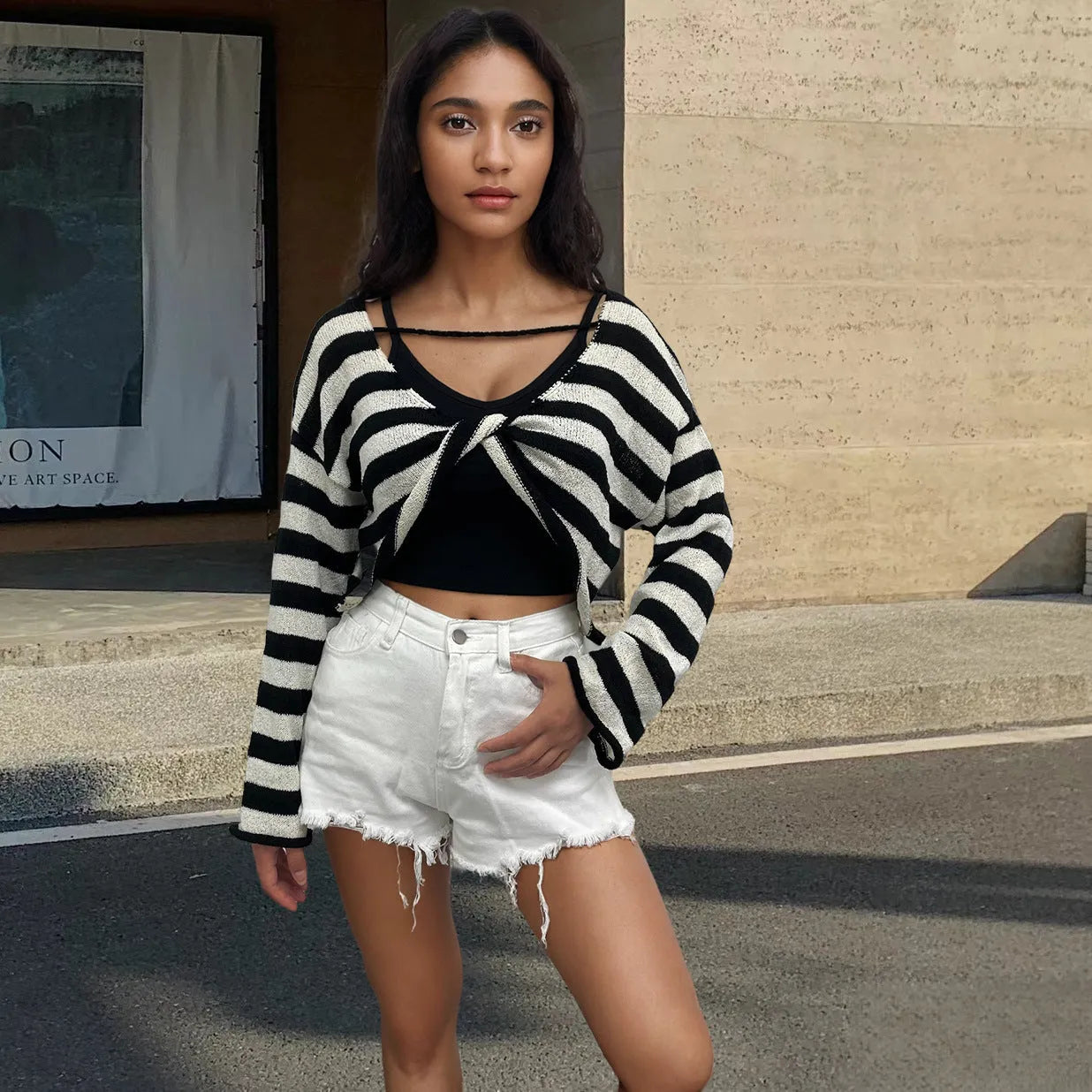 Women's striped long-sleeved sweater with exposed navel detail in mercerised cotton