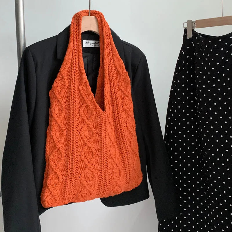 Women's retro-style knitted crochet tote bag with double shoulder straps in a solid colour.