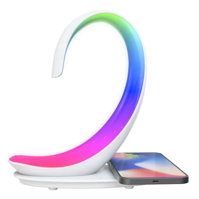 White swan-shaped desktop wireless charger with Bluetooth speaker and colourful atmosphere light
