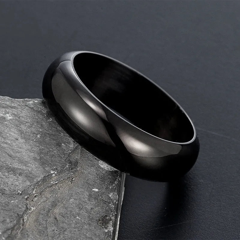 Glossy electroplated titanium steel ring shown in gold, black, and steel colour options on a plain background.