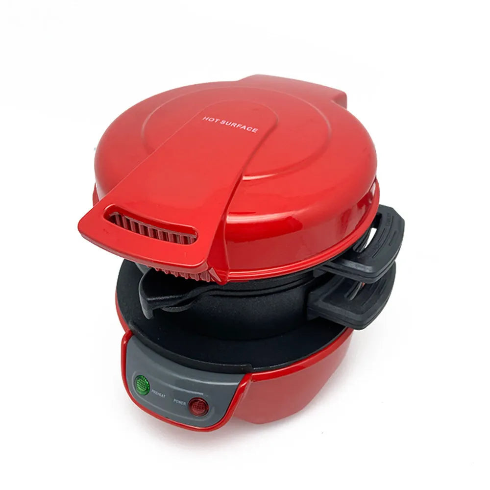 Bright red breakfast sandwich maker with egg cooker ring and baking trays on kitchen counter