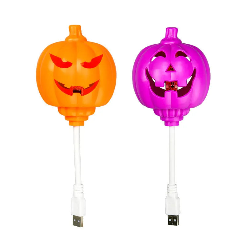 Plastic pumpkin lamp with USB port showing yellow and purple light options