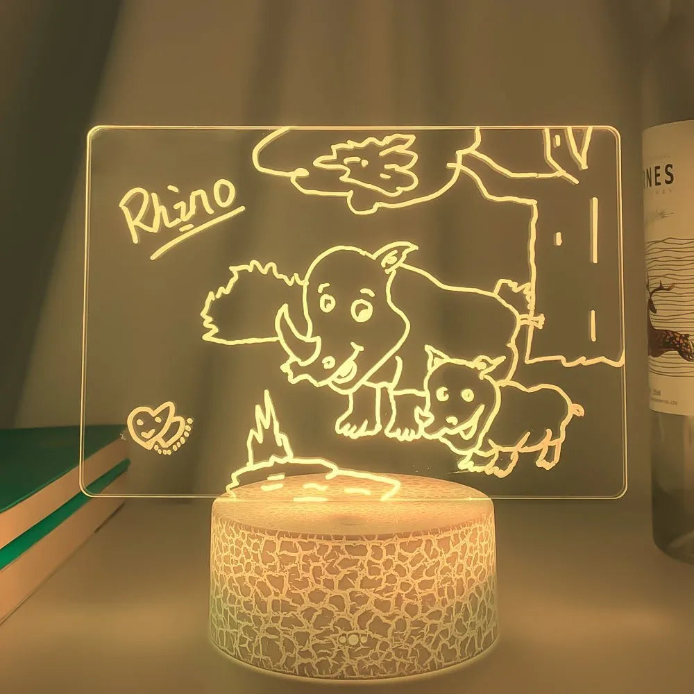 3D acrylic message board lamp with black crack base displaying handwritten text and glowing with multi-colour LED light