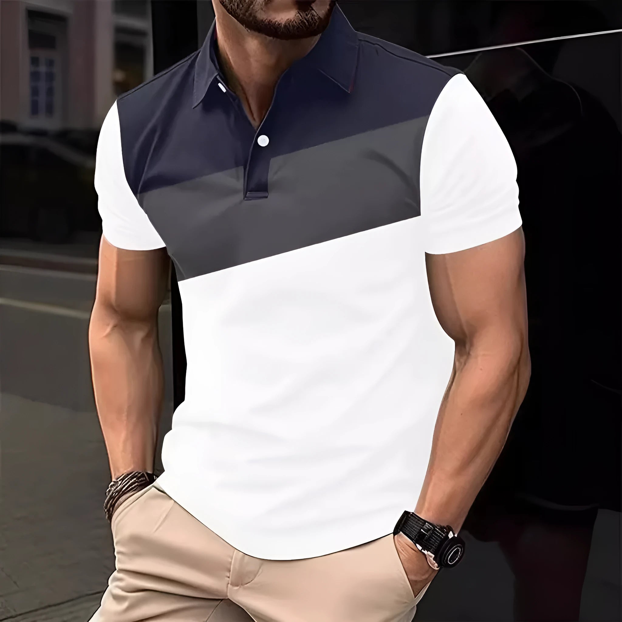 Man wearing a loose fit grey t-shirt with a colourful 3D digital printed abstract pattern on the front.