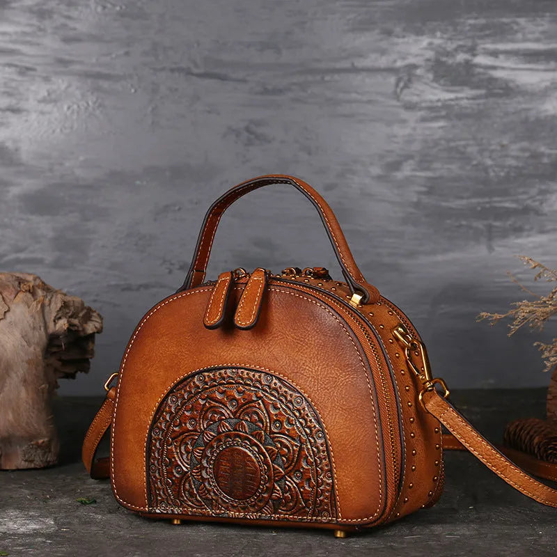 Vintage cowhide suede leather handbag showing internal organisation compartments including ID pouch and mobile phone section