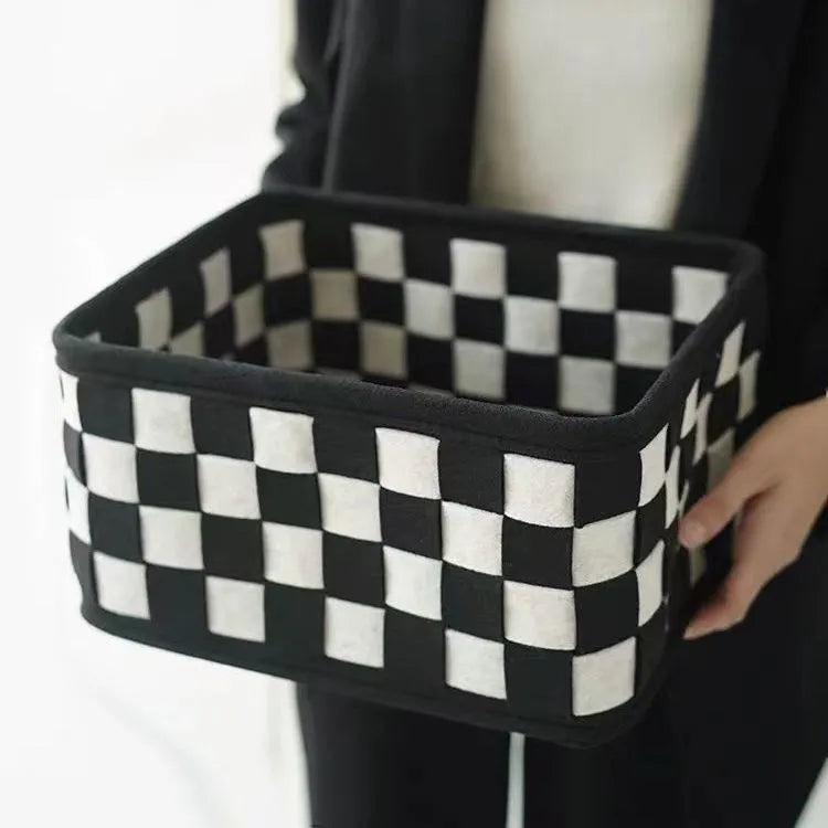 Checkerboard woven grey felt storage basket with folded sides showing its 37x29x19.5cm size.