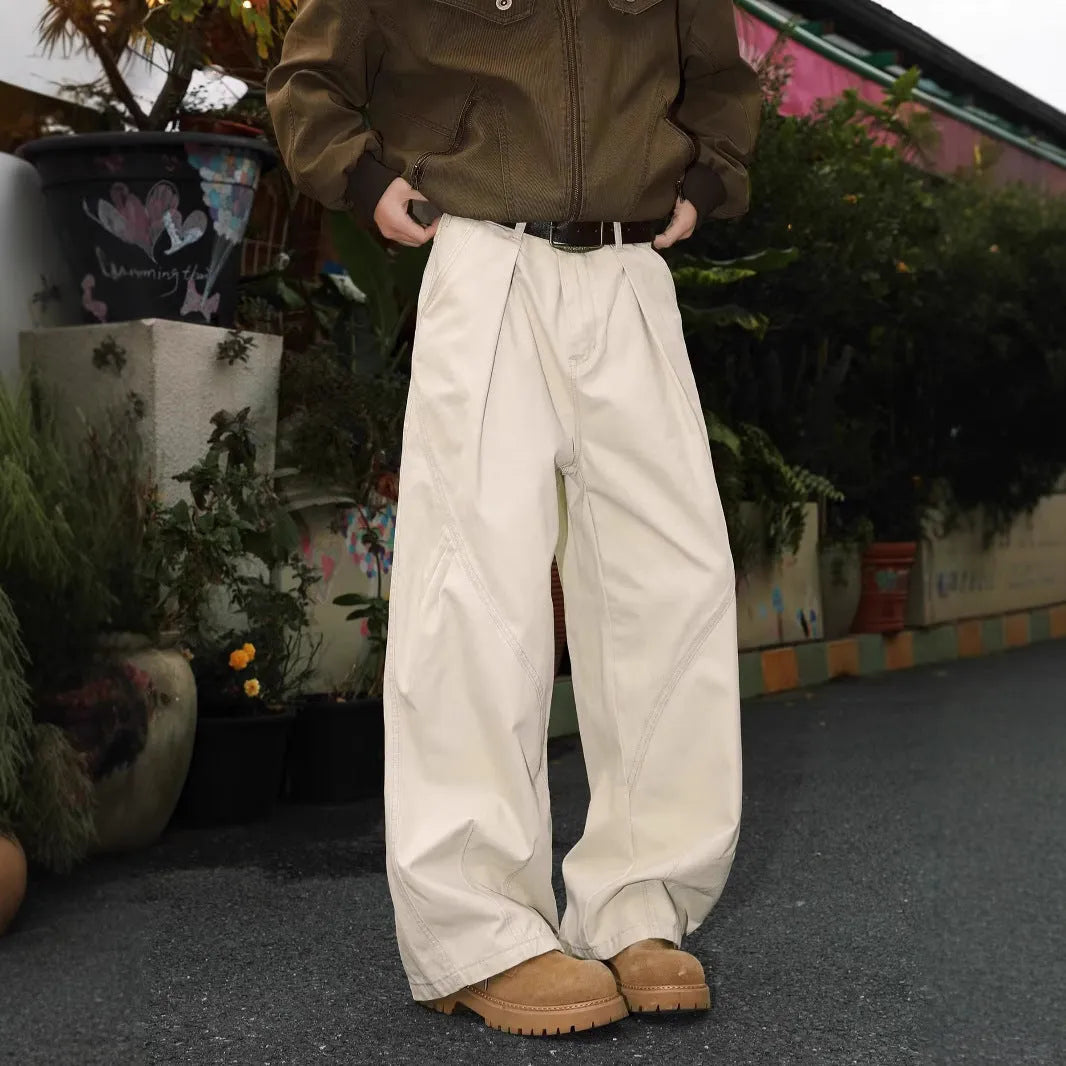 Men's pleated straight-leg trousers in loose fit showing Black, Brown and Apricot colour options