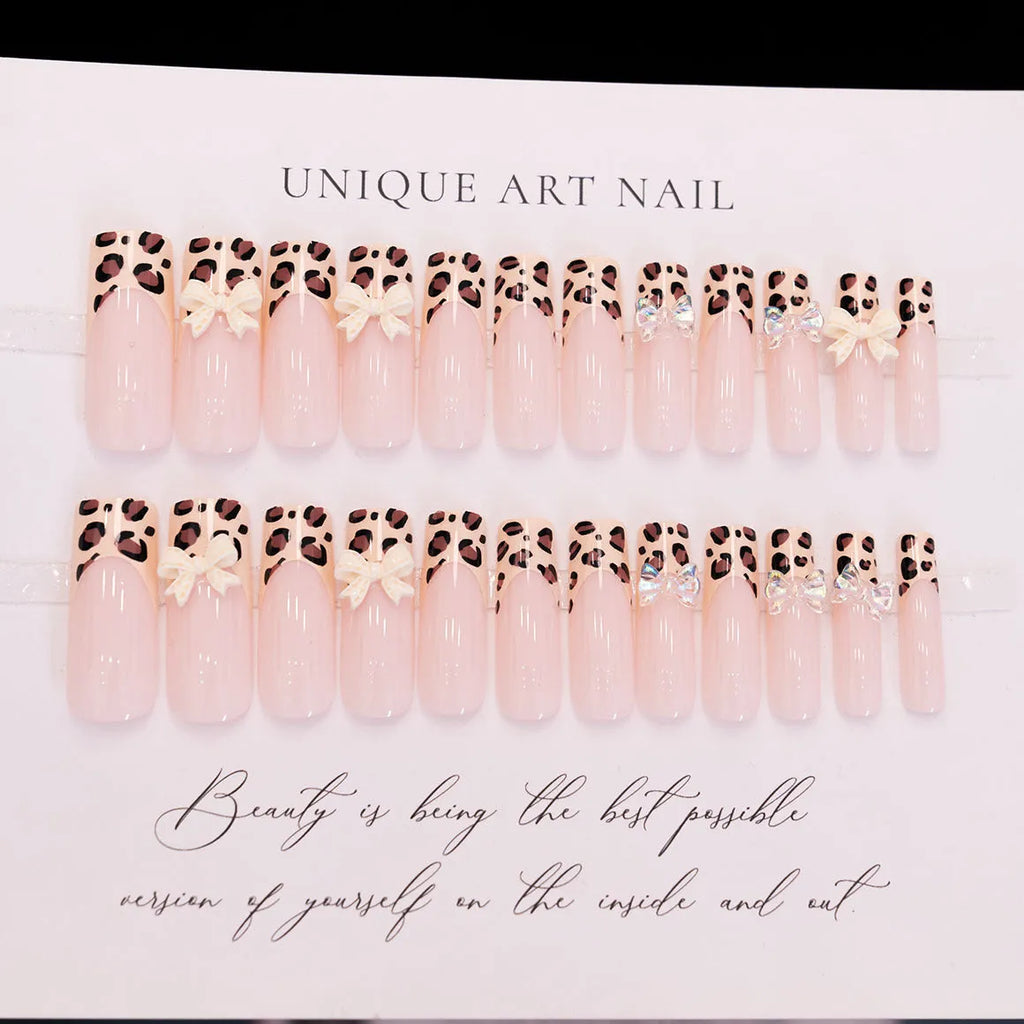 Leopard print butterfly designs on plastic false nails in WM296 colour for ladies manicure