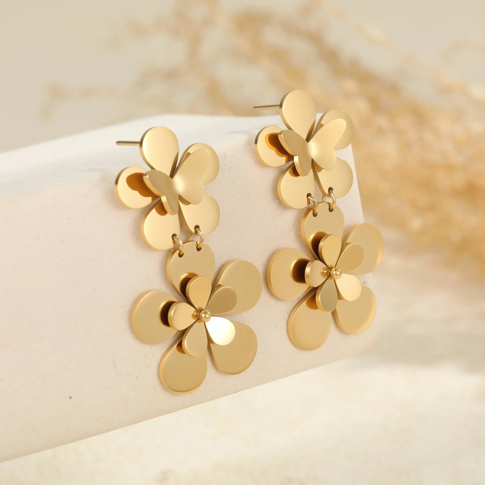 Gold plated stainless steel earrings featuring flower and butterfly geometric design for women