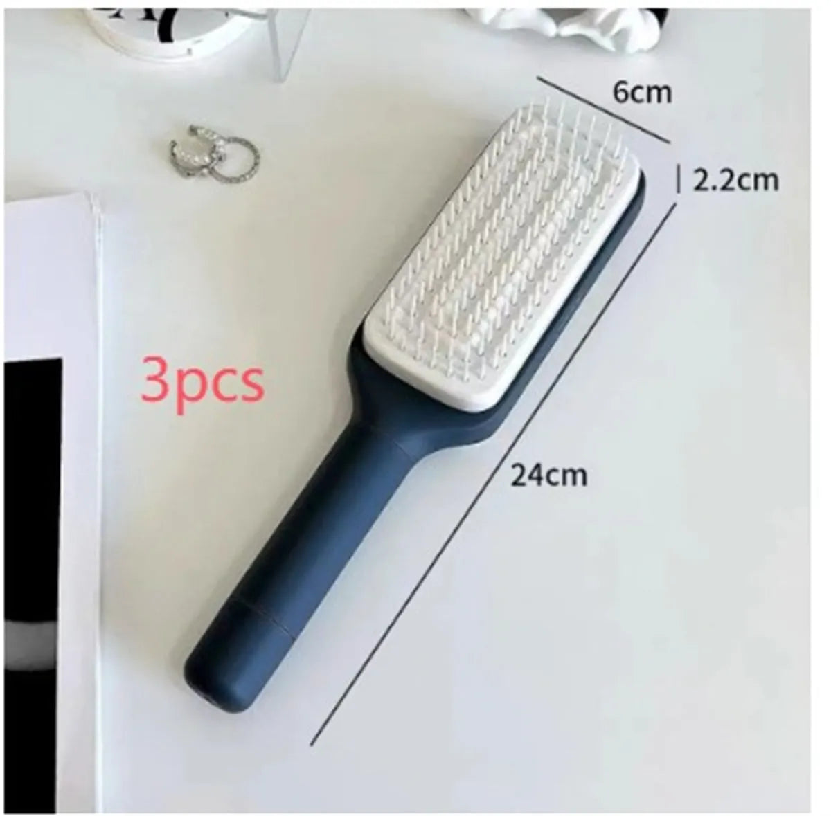 Roland purple self-cleaning hair brush with rotating handle and anti-static massage bristles.