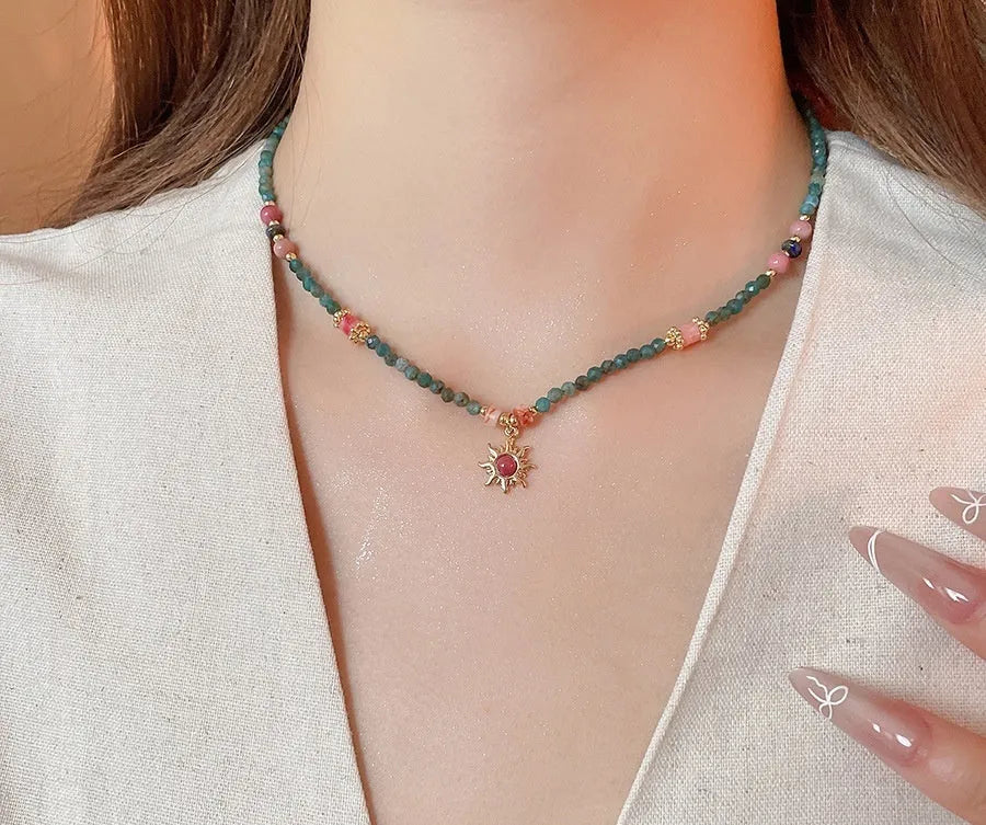 Freshwater pearl necklace with stone sun pendant on adjustable clavicle chain
