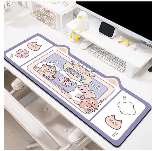 Oversized injection moulded natural rubber desk pad in Pink Bunny, Purple Bear, or Purple Kitten design on a desk.