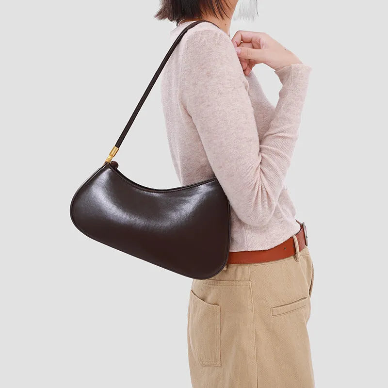 Structured oval women's underarm bag in PU leather with a single strap, shown in a colour option.