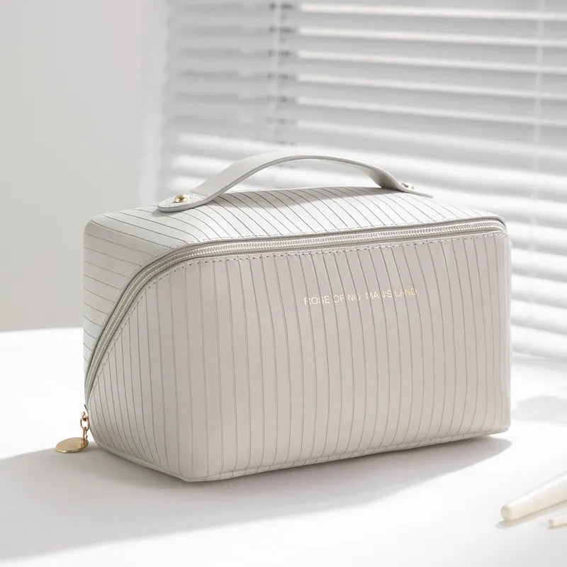 Cubic PU makeup bag with vertical pattern pillow design measuring 22.5cm
