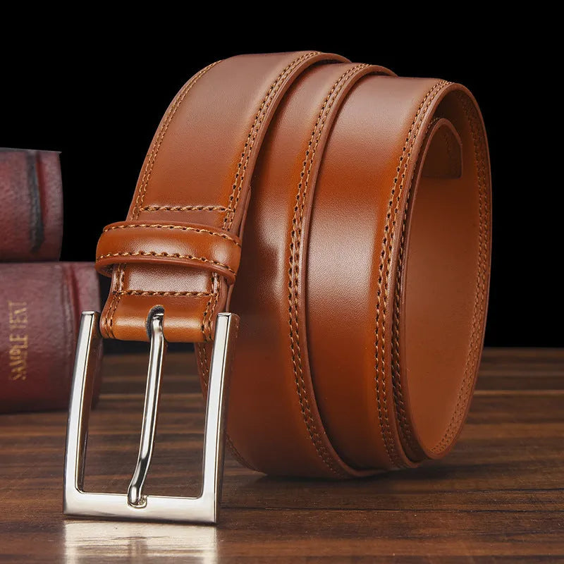 Men's black leather belt with a silver alloy pin buckle, showing the patent leather finish.