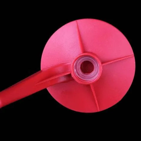 Red plastic Magic Tap soda drink dispenser for 2-litre bottles