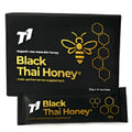 Glass jar containing 1kg of black Thai honey with natural characteristics