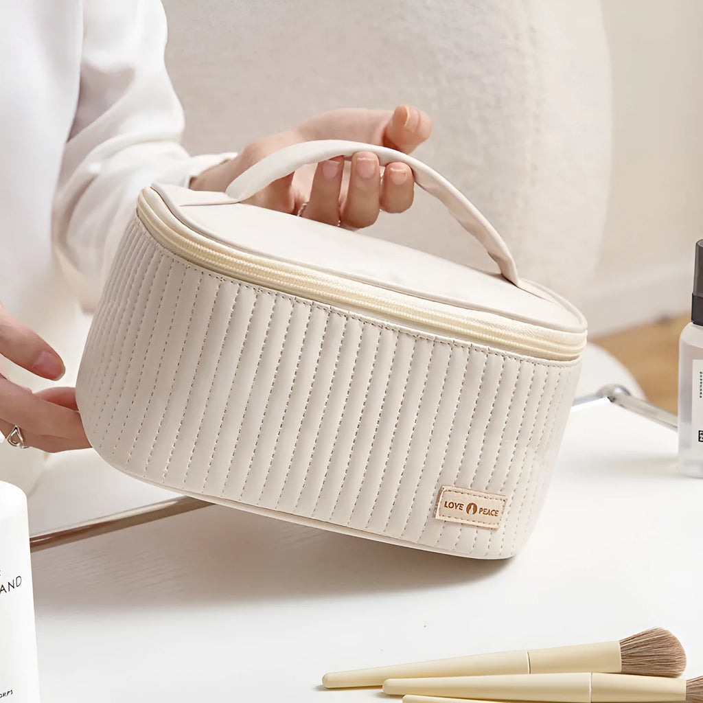 Open-top PU leather makeup bag in a choice of six solid colours including pink, beige and light blue.