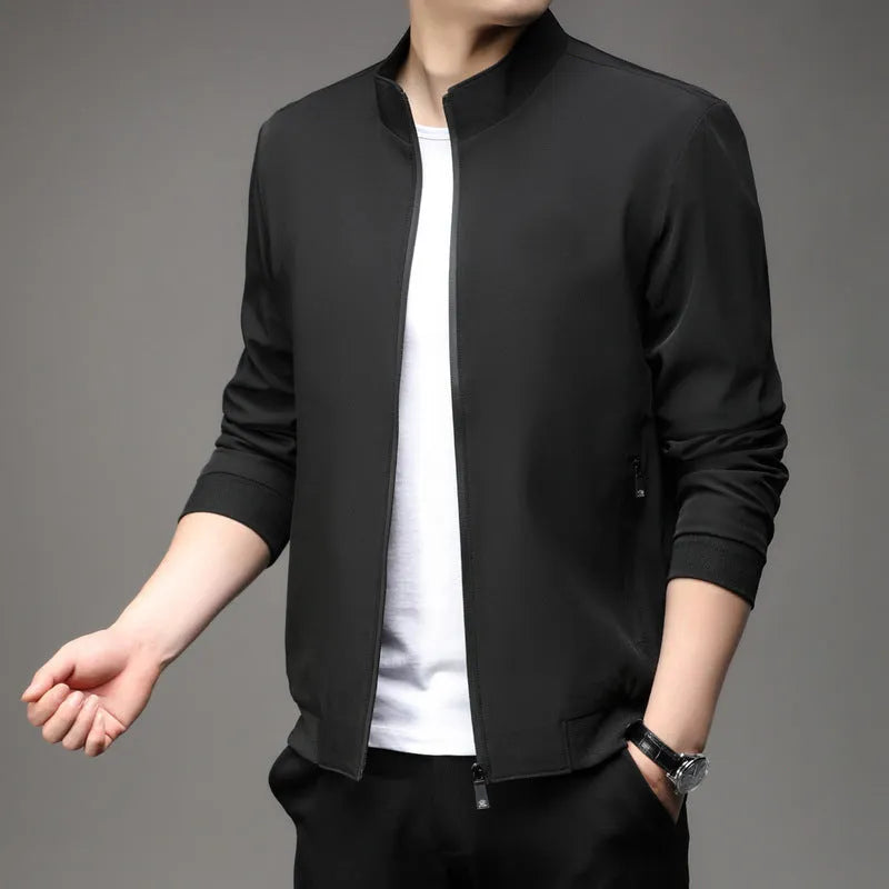 Man wearing black loose-fit Korean style autumn jacket with zip pockets