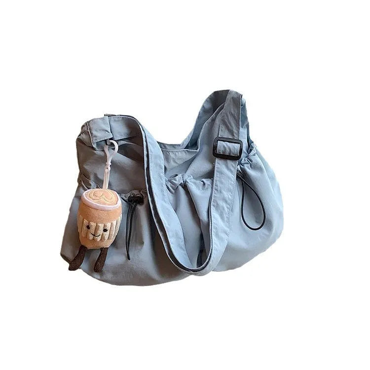 Ultra-light pleated crossbody student bag in polyester with folding design and internal phone pocket