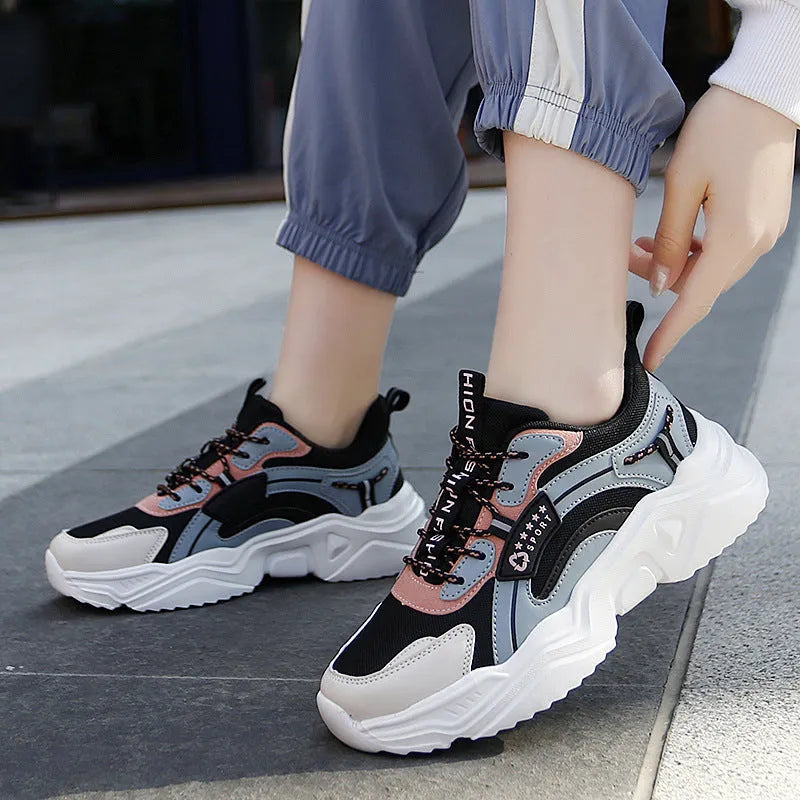 Women's white thick-soled casual sports shoes with mesh upper and buckle detail in Moonlight colour.