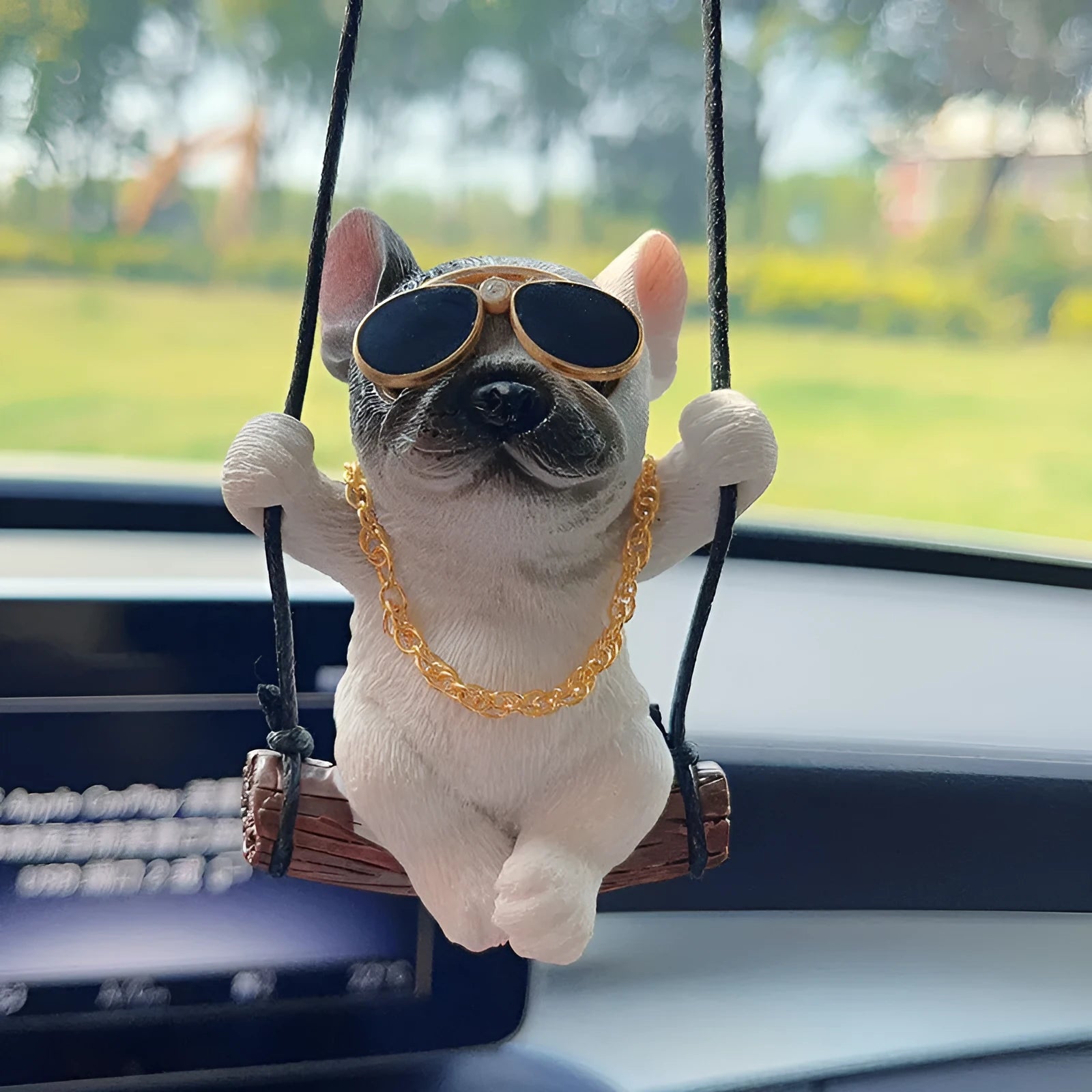 Resin cartoon bulldog car hanging ornament for a rearview mirror in various colours.