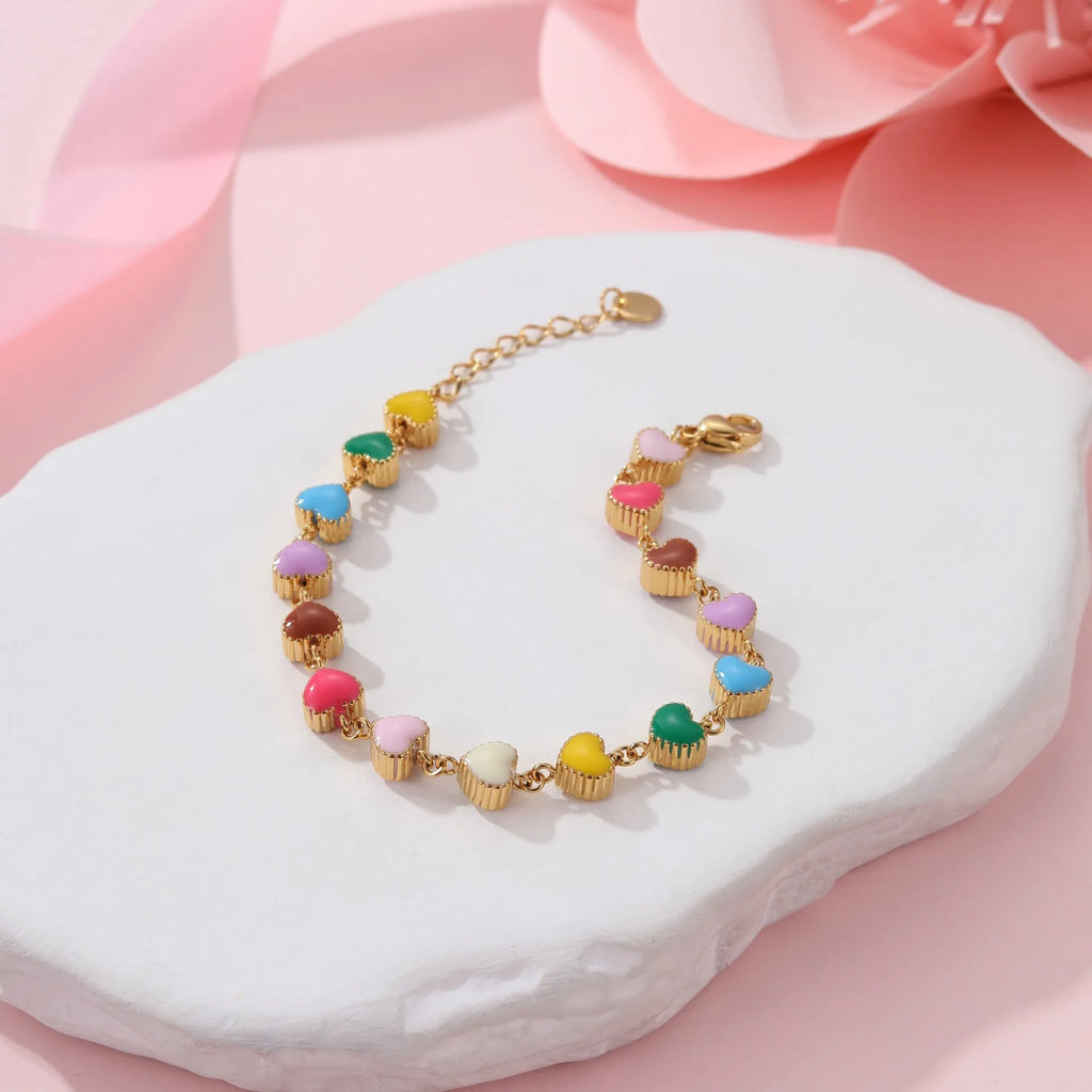 Women's stainless steel bracelet with heart pendant and colourful oil necklace elements