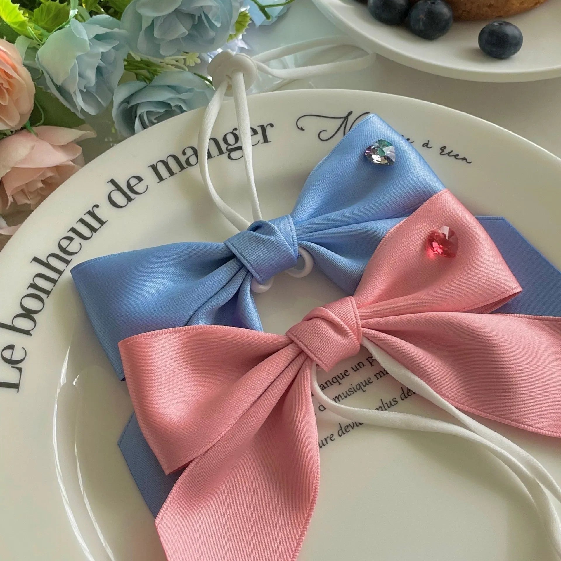 Princess style dog headdress hair band with adjustable bow tension on white background