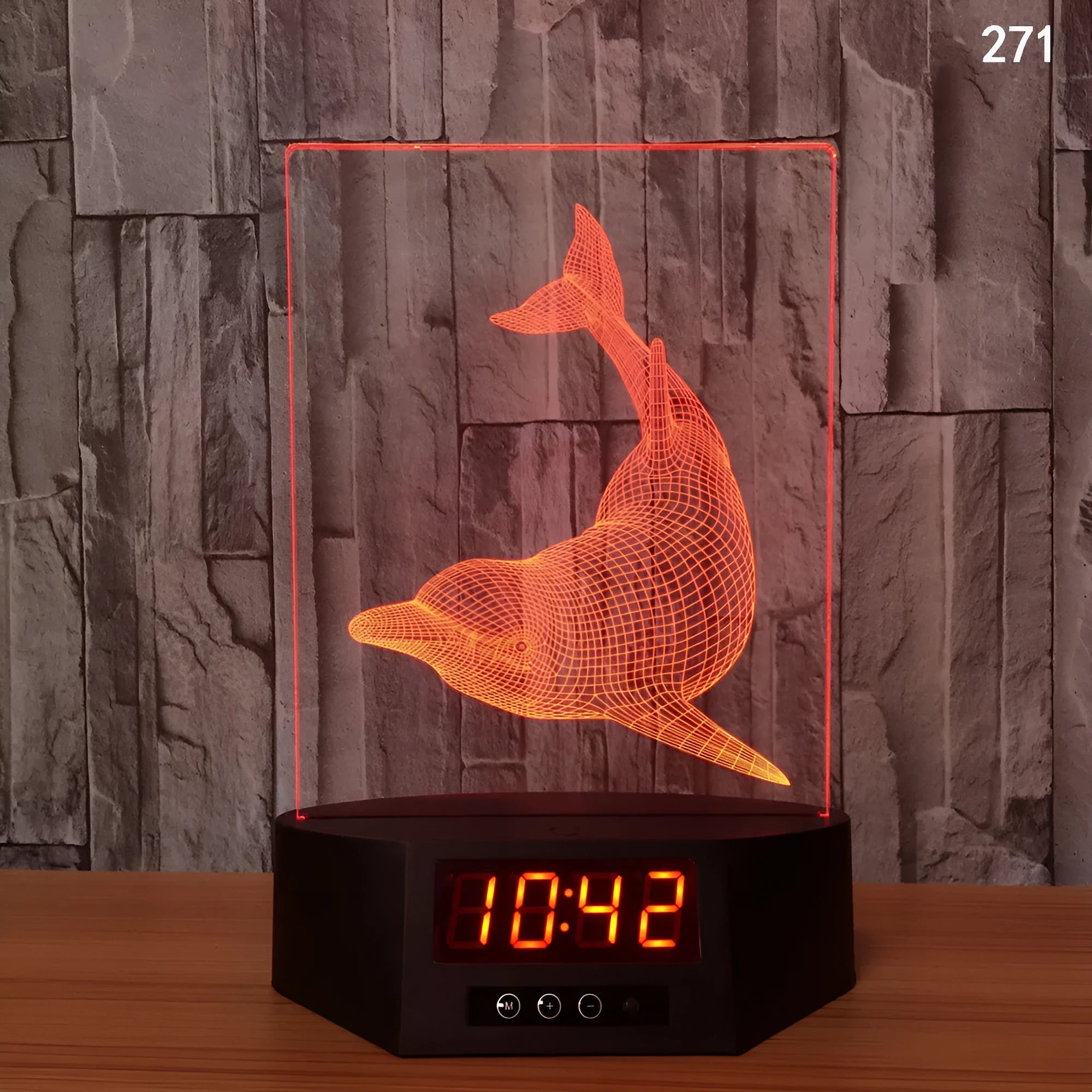 Blue dolphin 3D LED night light on a table with remote control