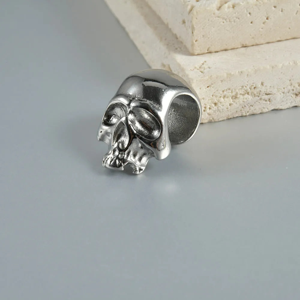 Stainless steel hollow skull Buddha earrings with geometric design and electroplated colour finishes