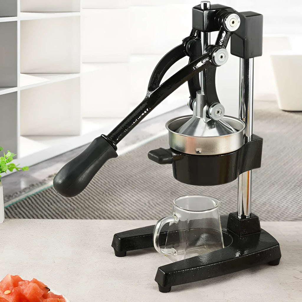 Upgraded black manual cast iron juicer with stainless steel funnel, 40 cm tall on a kitchen counter.