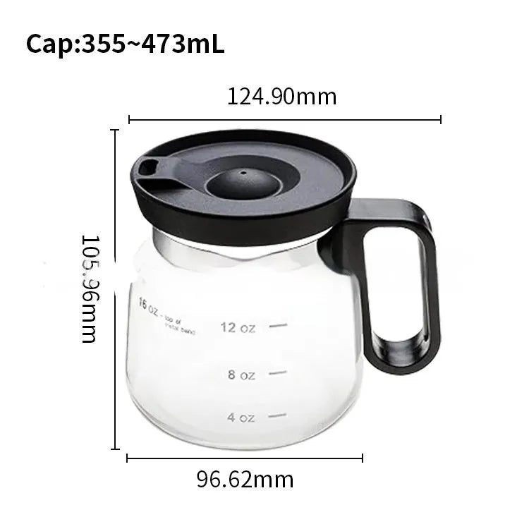 Transparent borosilicate glass coffee maker with black silicone cover on a kitchen counter.