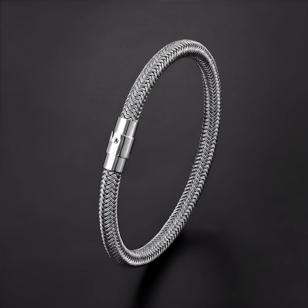 Men's geometric titanium steel bracelet with a magnetic clasp on a wrist.