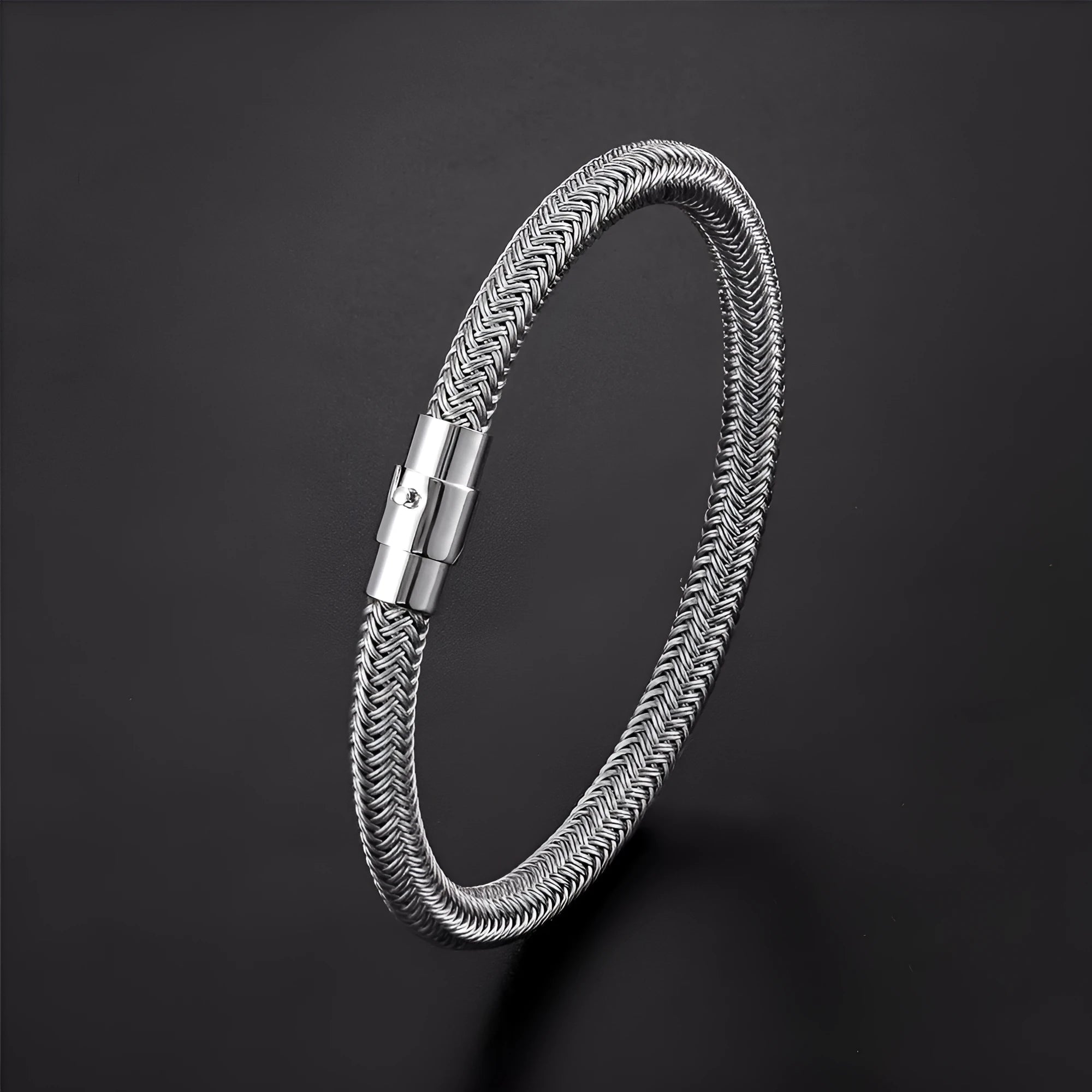 Men's geometric titanium steel bracelet with a magnetic clasp on a wrist.