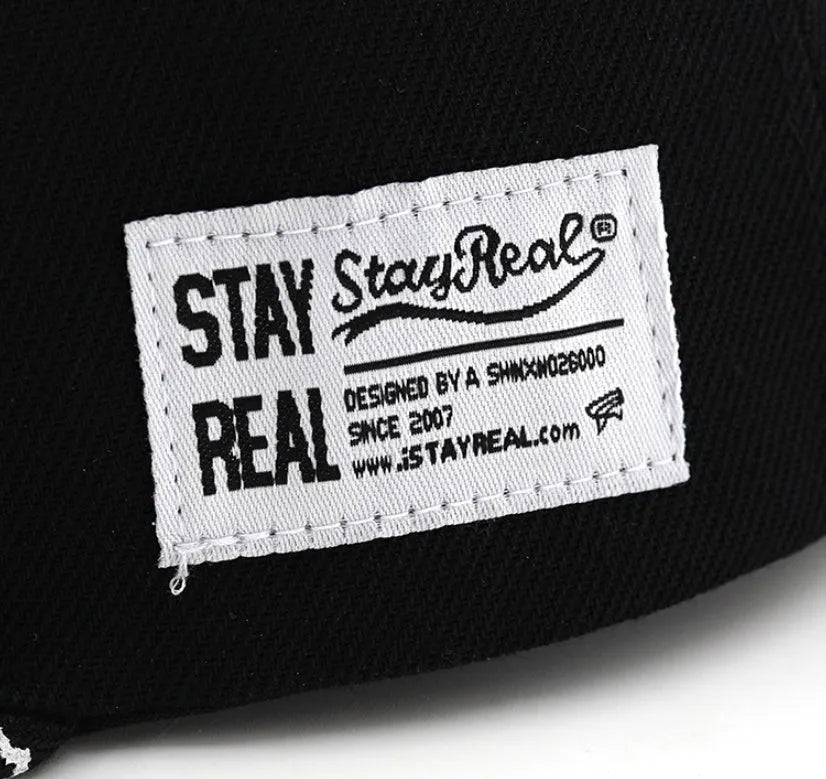 Cotton baseball cap with letter embroidery in black colour showing adjustable strap