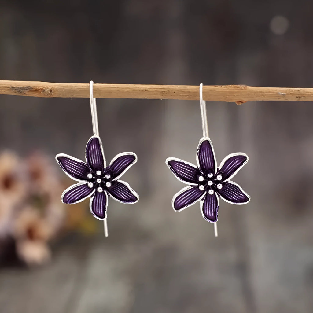 Purple flower-shaped earrings in lightweight alloy metal with electroplated finish