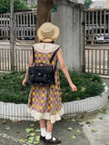 Women's black college style messenger bag made from oil wax PU leather showing front view