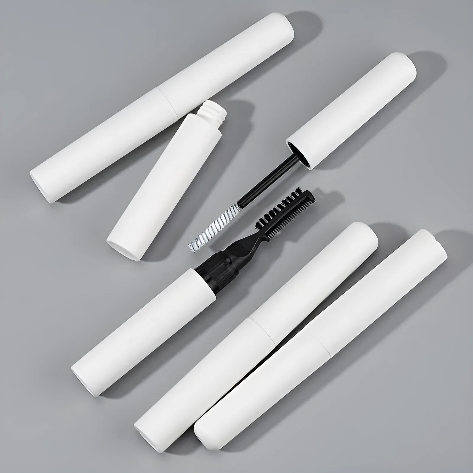 Eyebrow glue for natural shaping with one-brush application in pink or white colour options