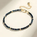 Blue tourmaline bracelet with 3mm cut beads and spacer design on white background