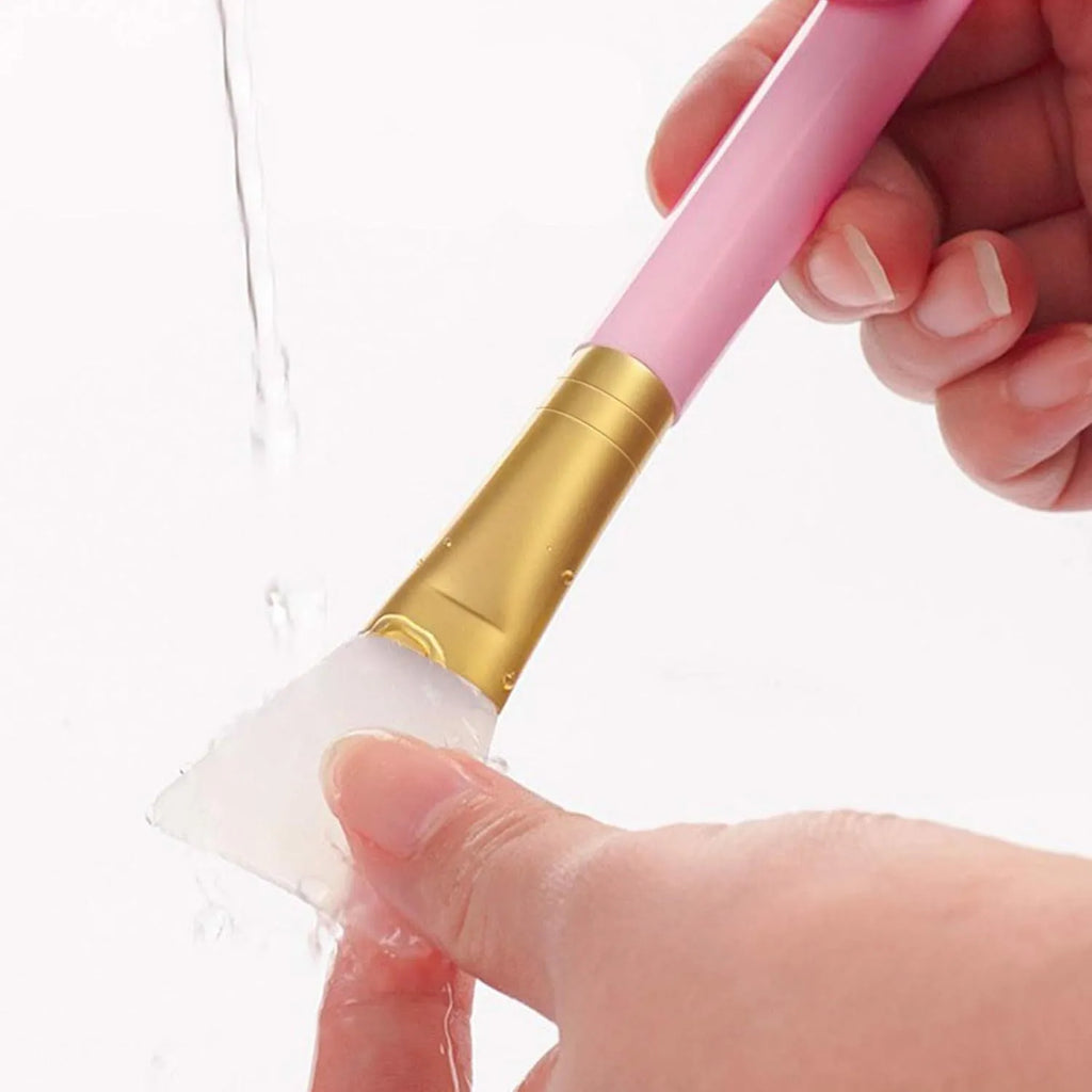 Reusable silicone face mask applicator spatula in one of six colours: black, blue, pink, rose red, white, or yellow.