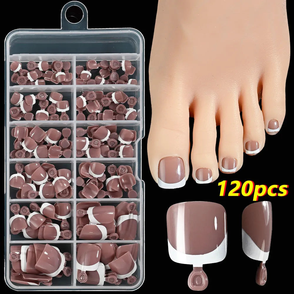 Open box showing 120 French style toe nail pieces with white tips in various nude colours.
