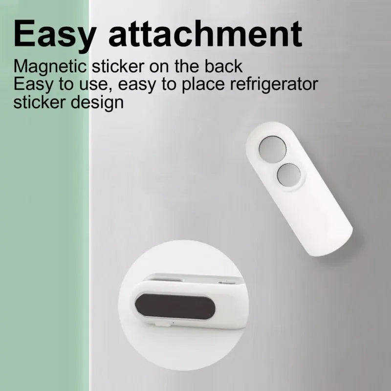 White and blue handheld USB heat sealer with cutter blade on a kitchen counter.