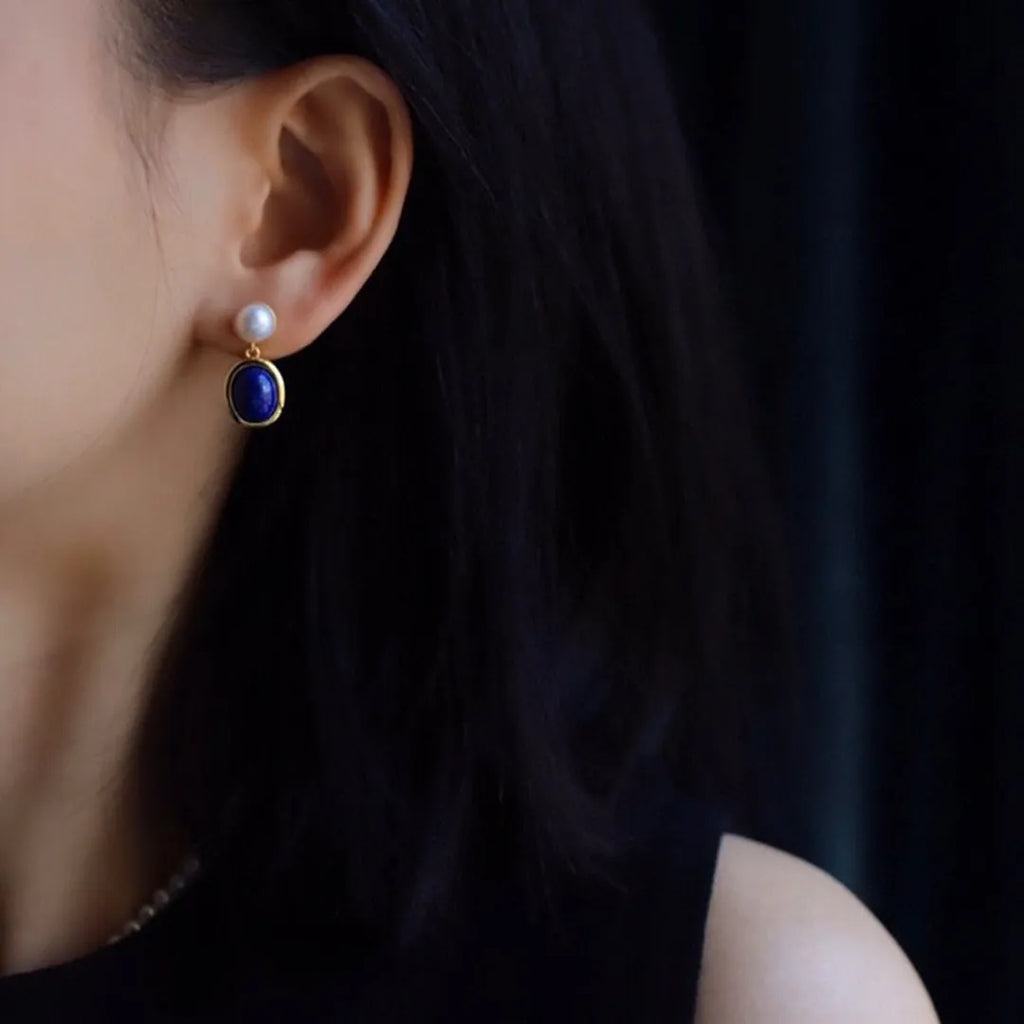 Silver earrings with blue lapis lazuli pearls and auspicious pattern details