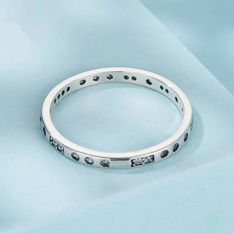 Moss Password I Love You oxidised black sterling silver ring on a simple bracelet band.