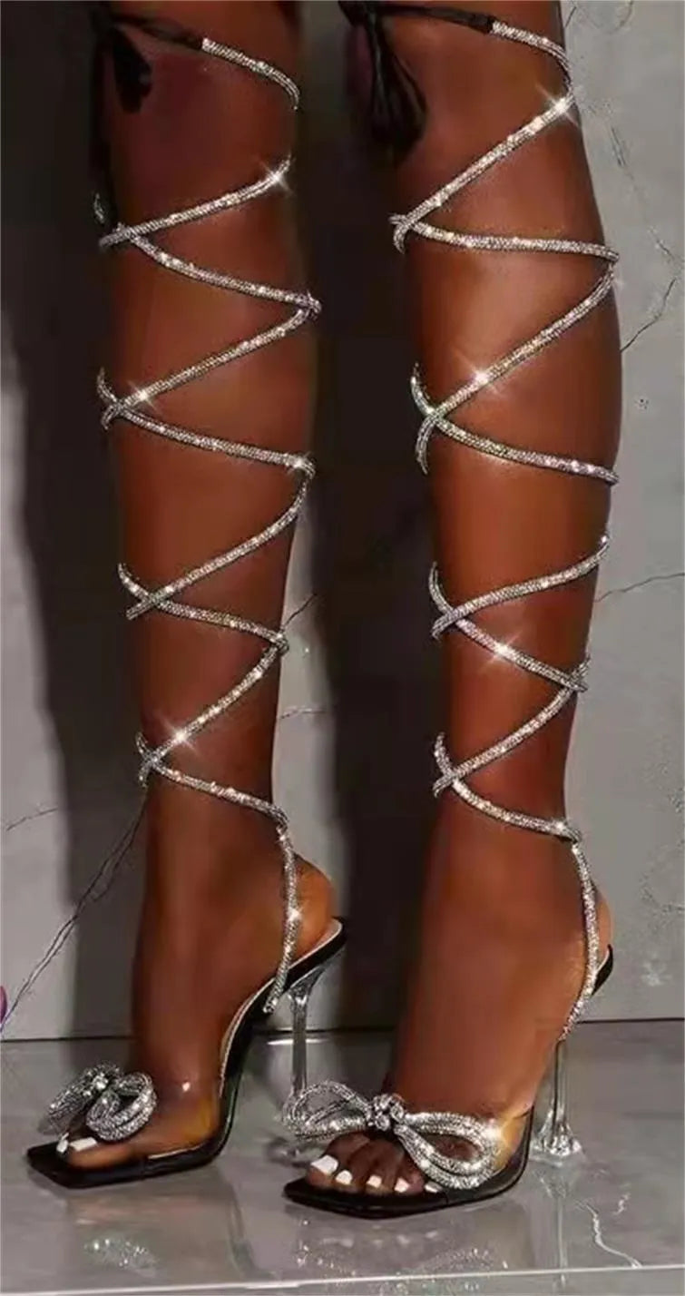 Plus size women's black strappy sandals with rhinestone straps and a square toe.