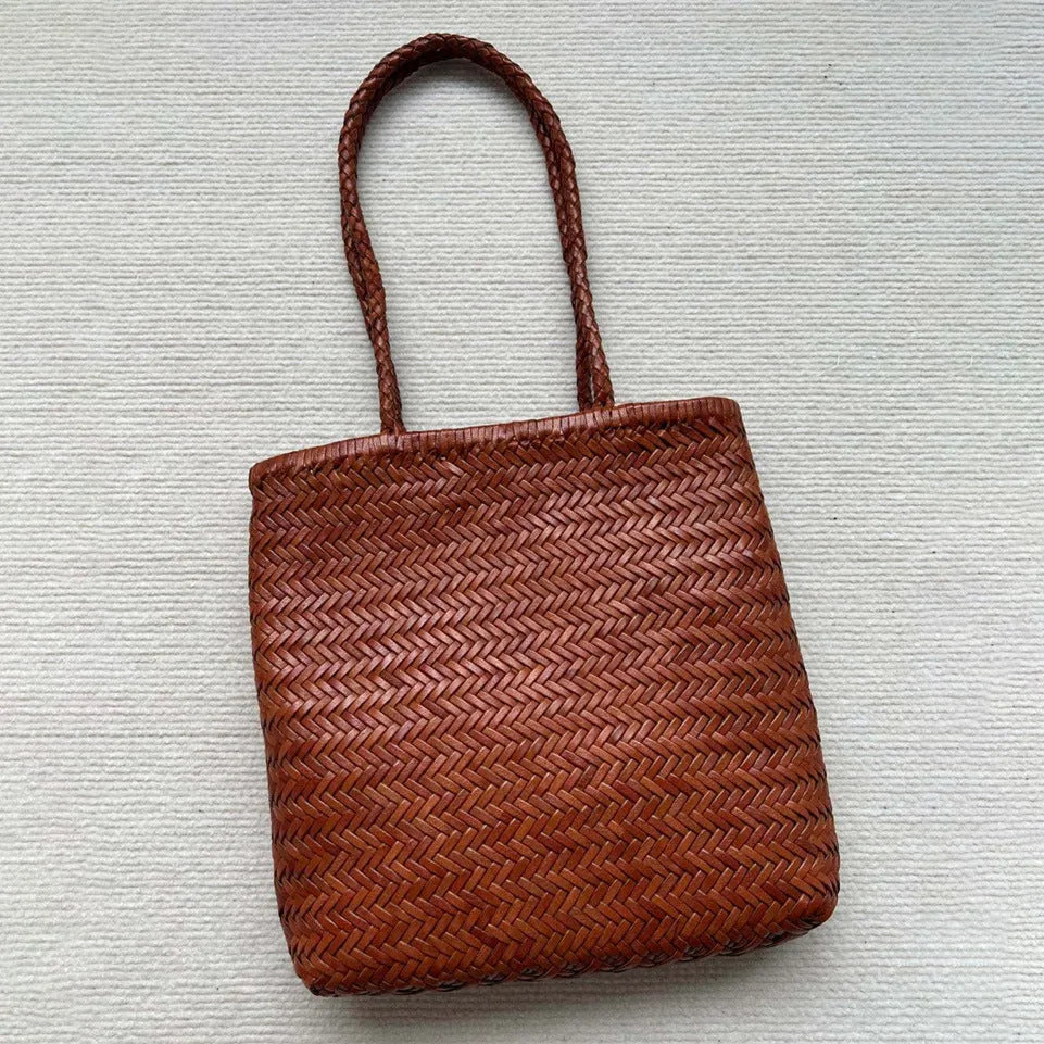 Brown woven leather tote bag with three-dimensional pocket and polyester lining
