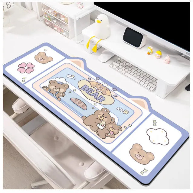 Oversized injection moulded natural rubber desk pad in Pink Bunny, Purple Bear, or Purple Kitten design on a desk.