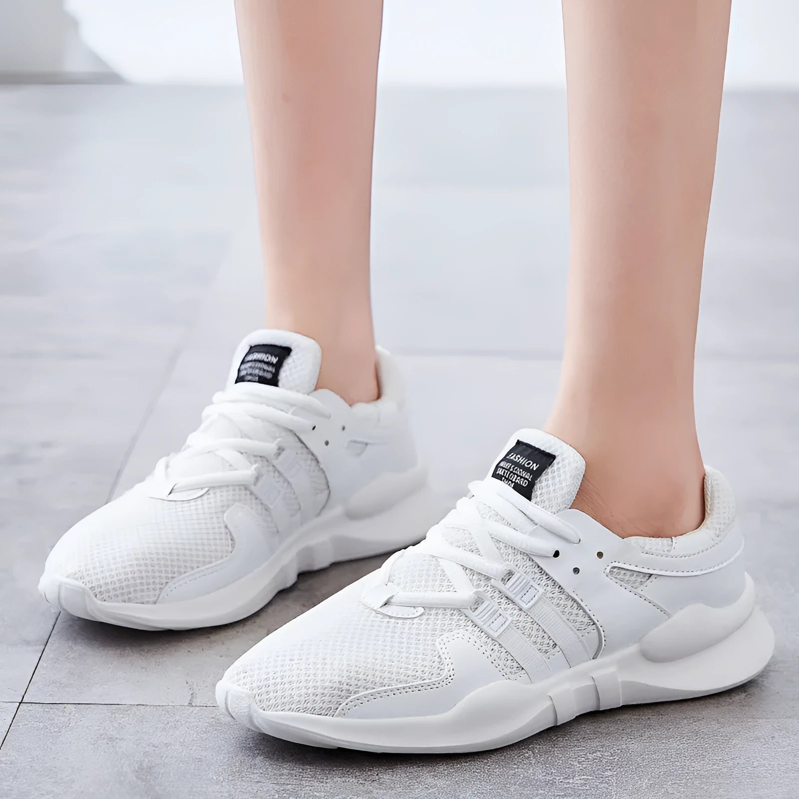 Breathable hollow-out mesh sneakers with low-top design and EVA sole in black and white colour options
