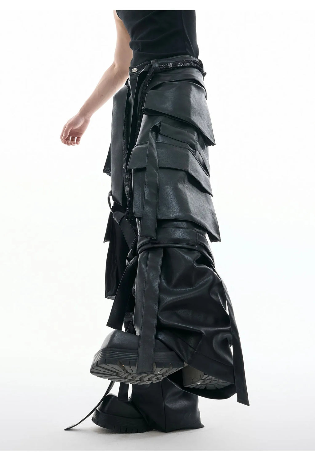 Black loose-fit retro leather pants with quilted panels and multiple pockets.