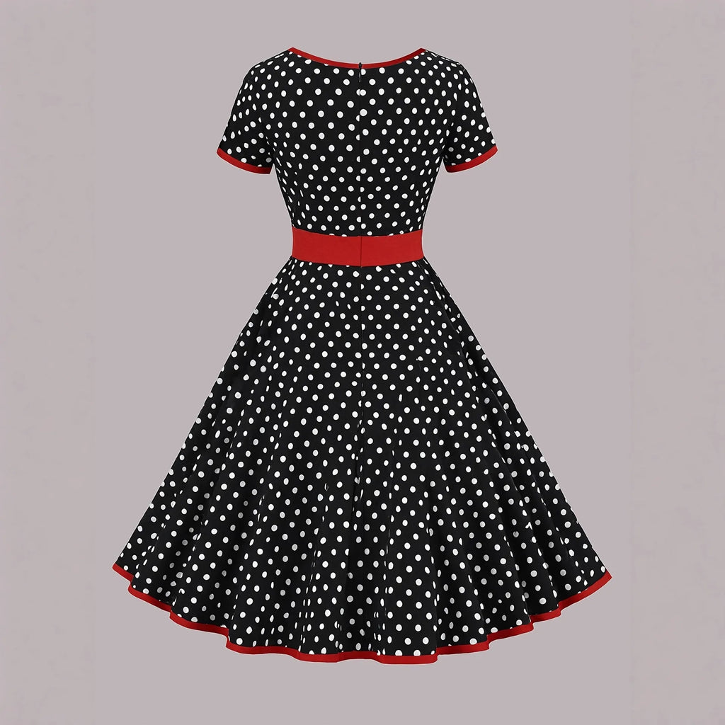 Multicolour polka dot pleated dress with a square collar and short sleeves.